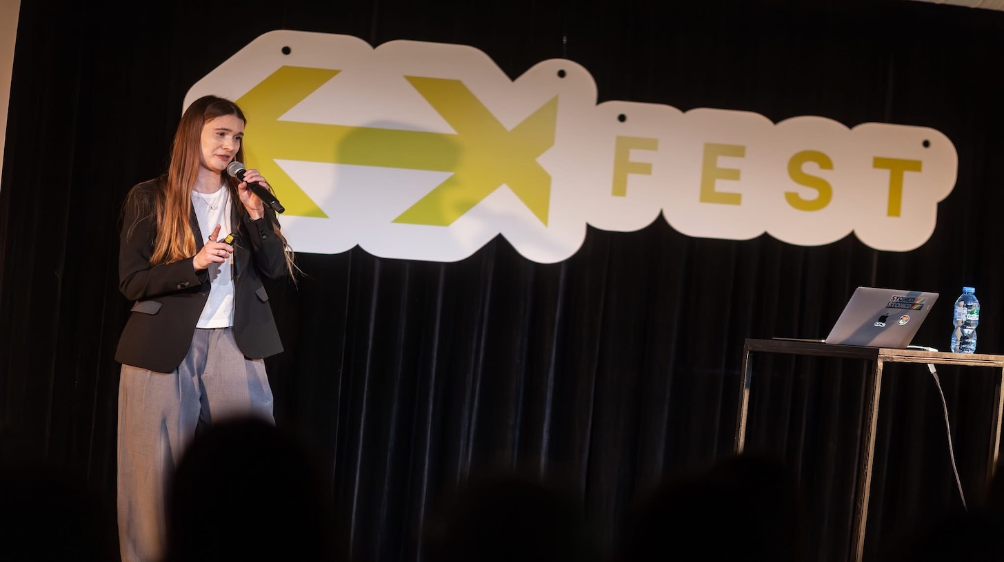 People attending EXFEST Warsaw during a UX and technology conference 