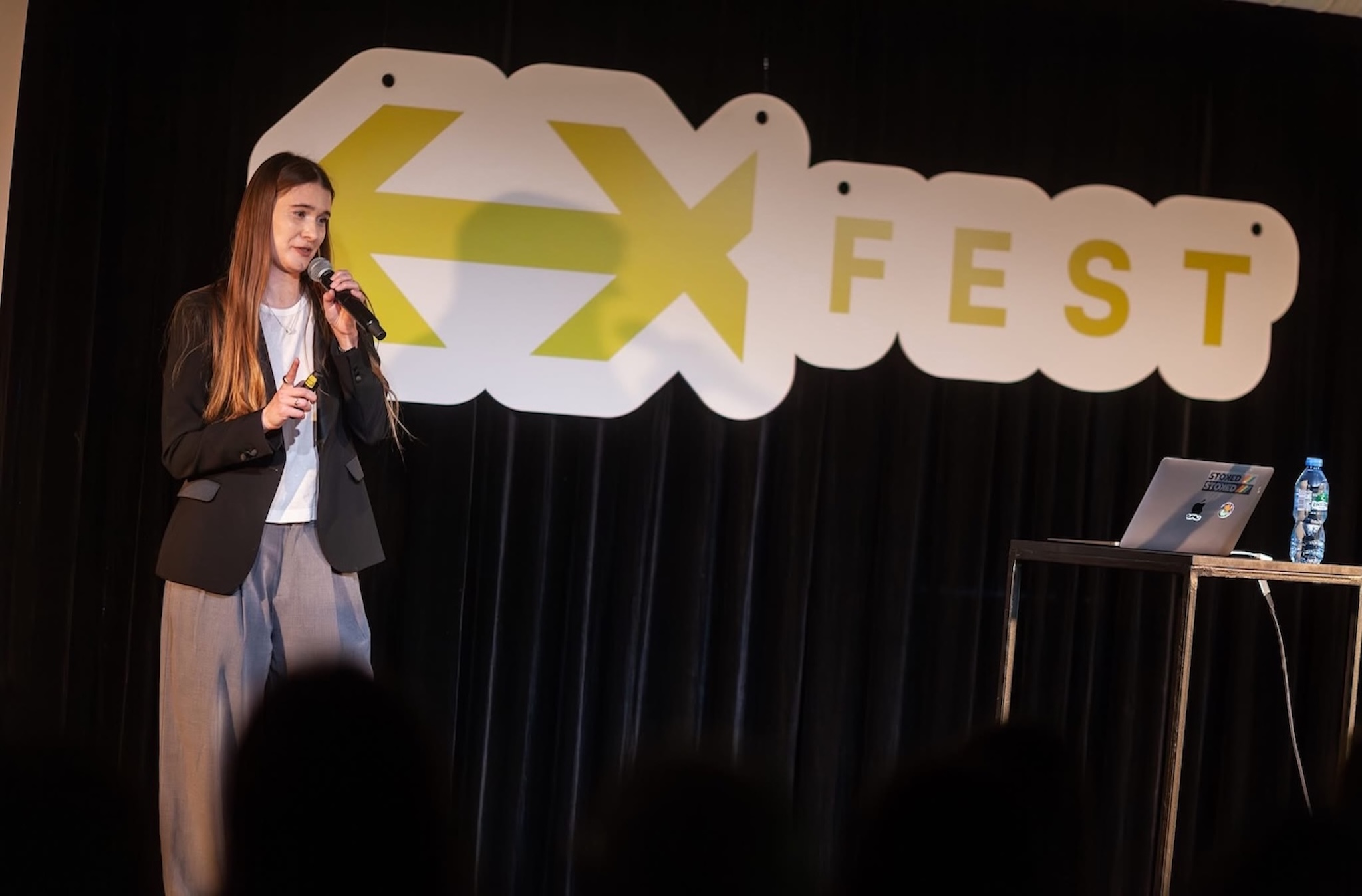 People attending EXFEST Warsaw during a UX and technology conference 