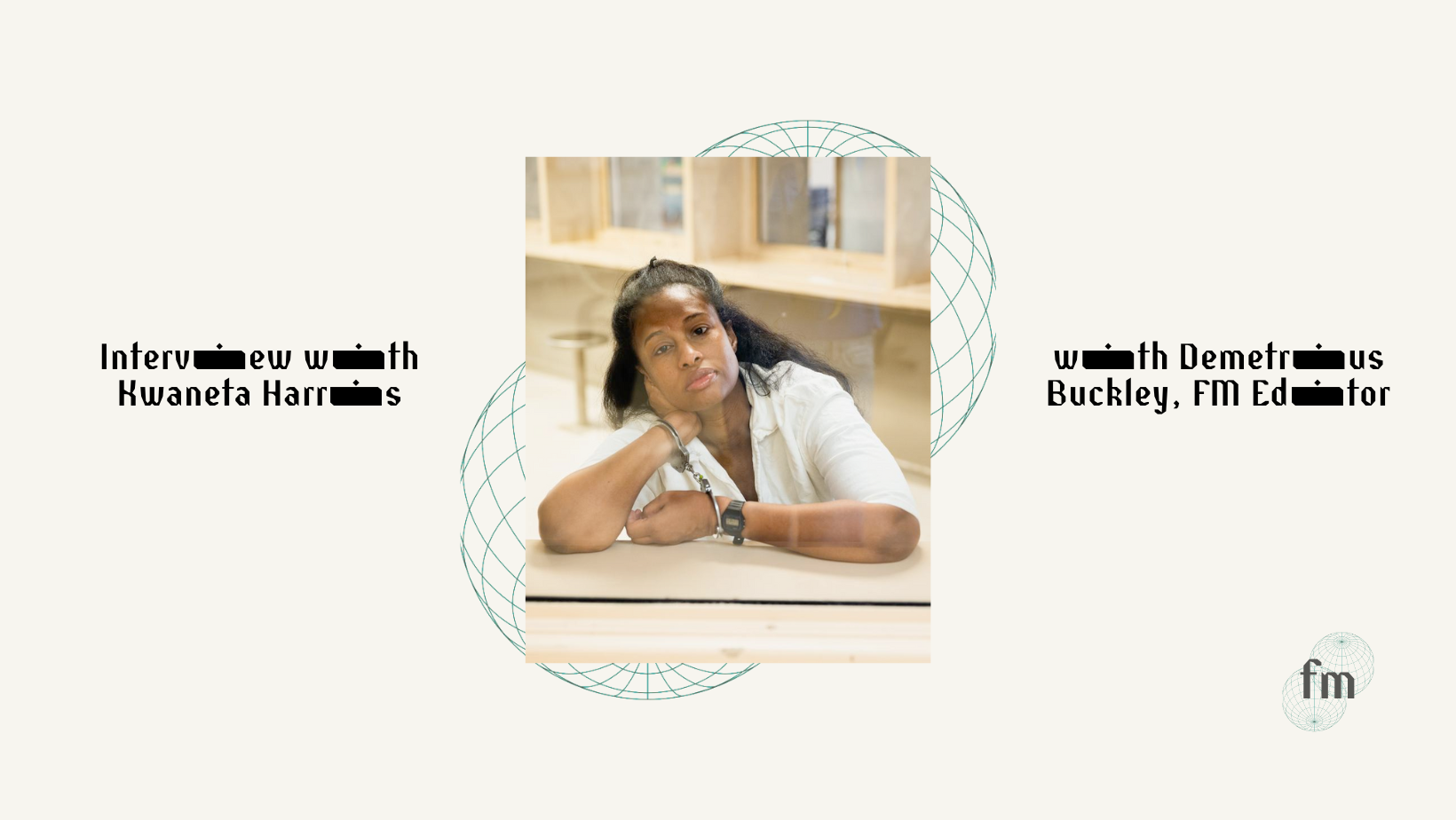 photo of the interviewee Harris. black woman with shoulder length black hair, wearing a white shirt, leaning with arms over a table