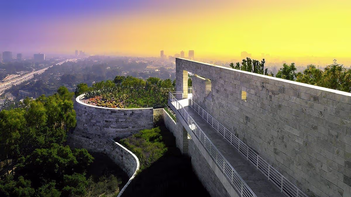 Modern concrete walkway with curved garden overlooking misty city skyline