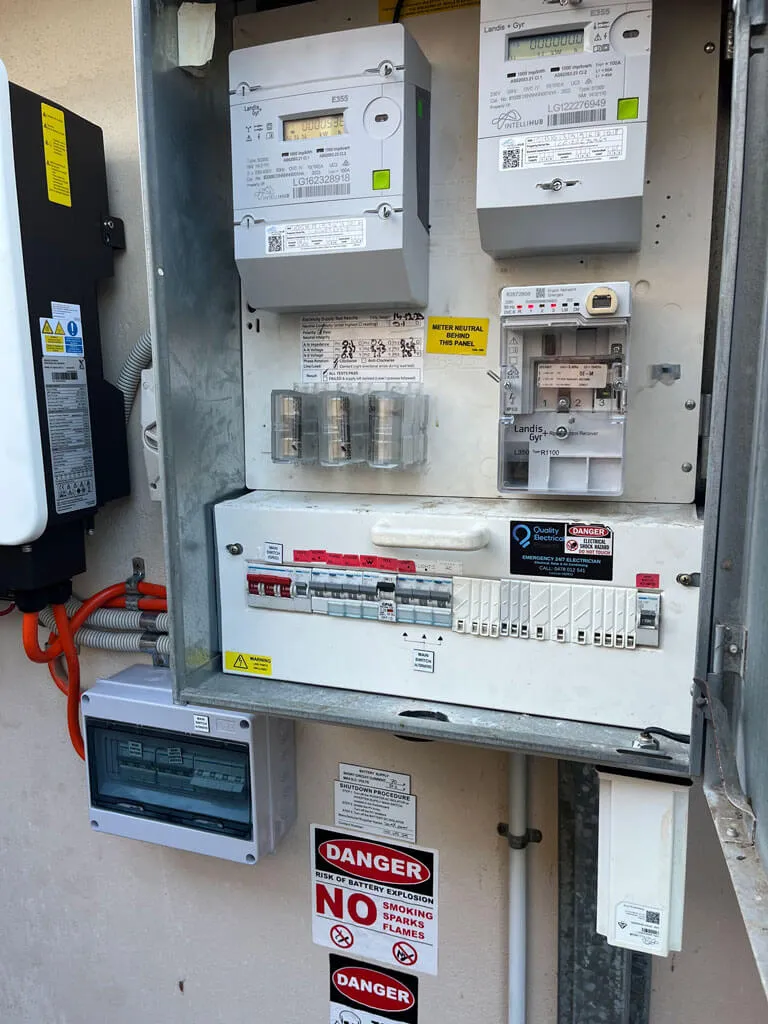 Electrical meter and circuit breaker panel with warning and danger signs
