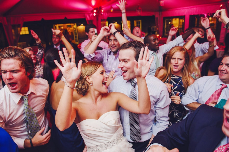 a bride and groom dance on the dance floor 