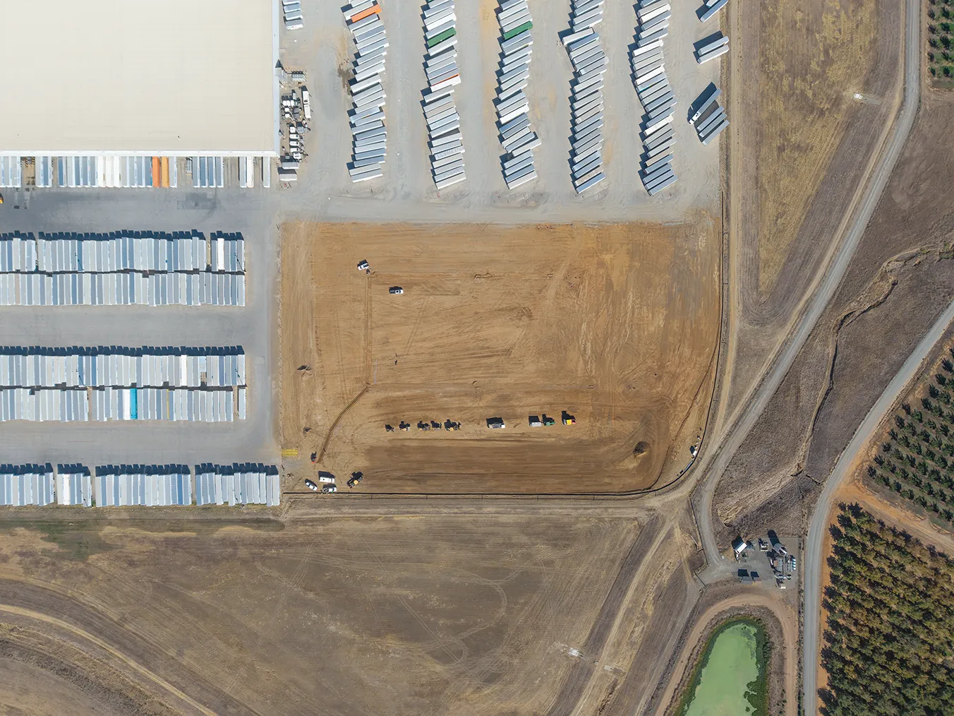 Top-down aerial view of the underground electrical and light-pole work area at the Red Bluff Distribution Center.