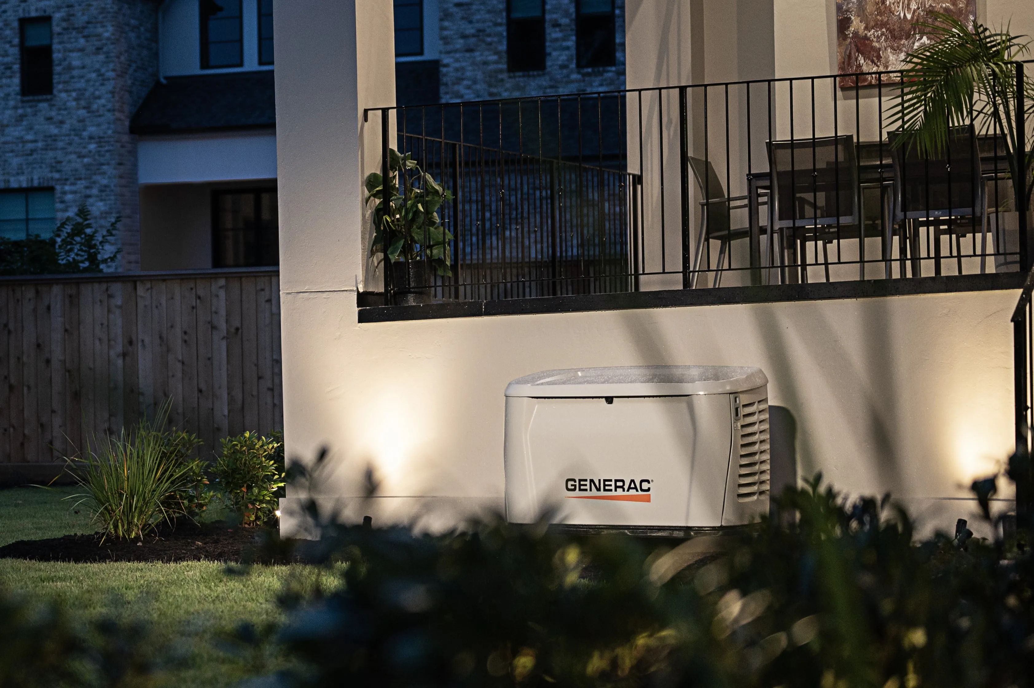 Generac standby generator installed beside a high-end residence.
