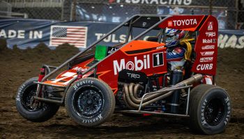 Dirt track race car that is red. 