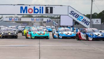 Black dragster on the pavement.