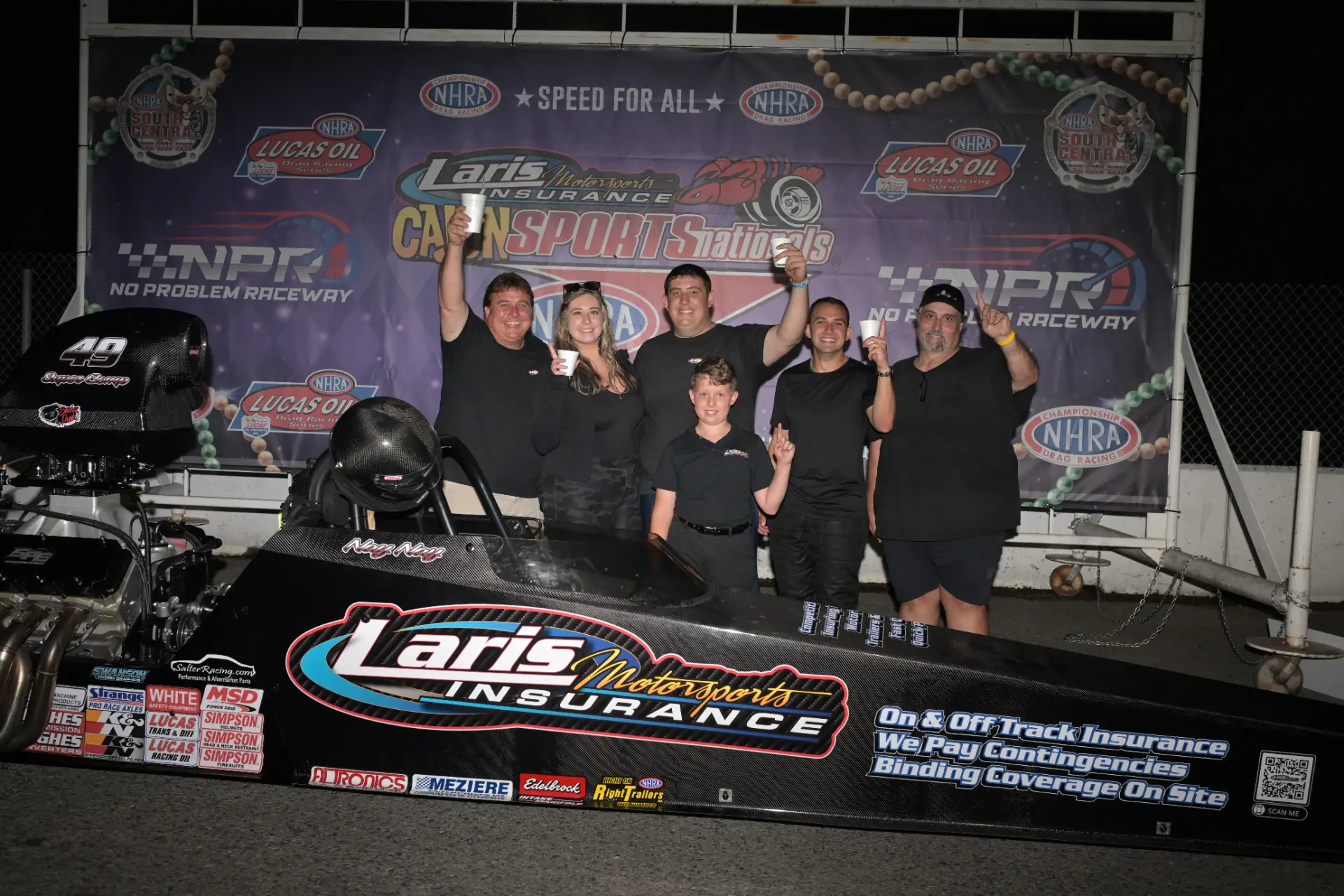 Top Fuel dragsters under tent
