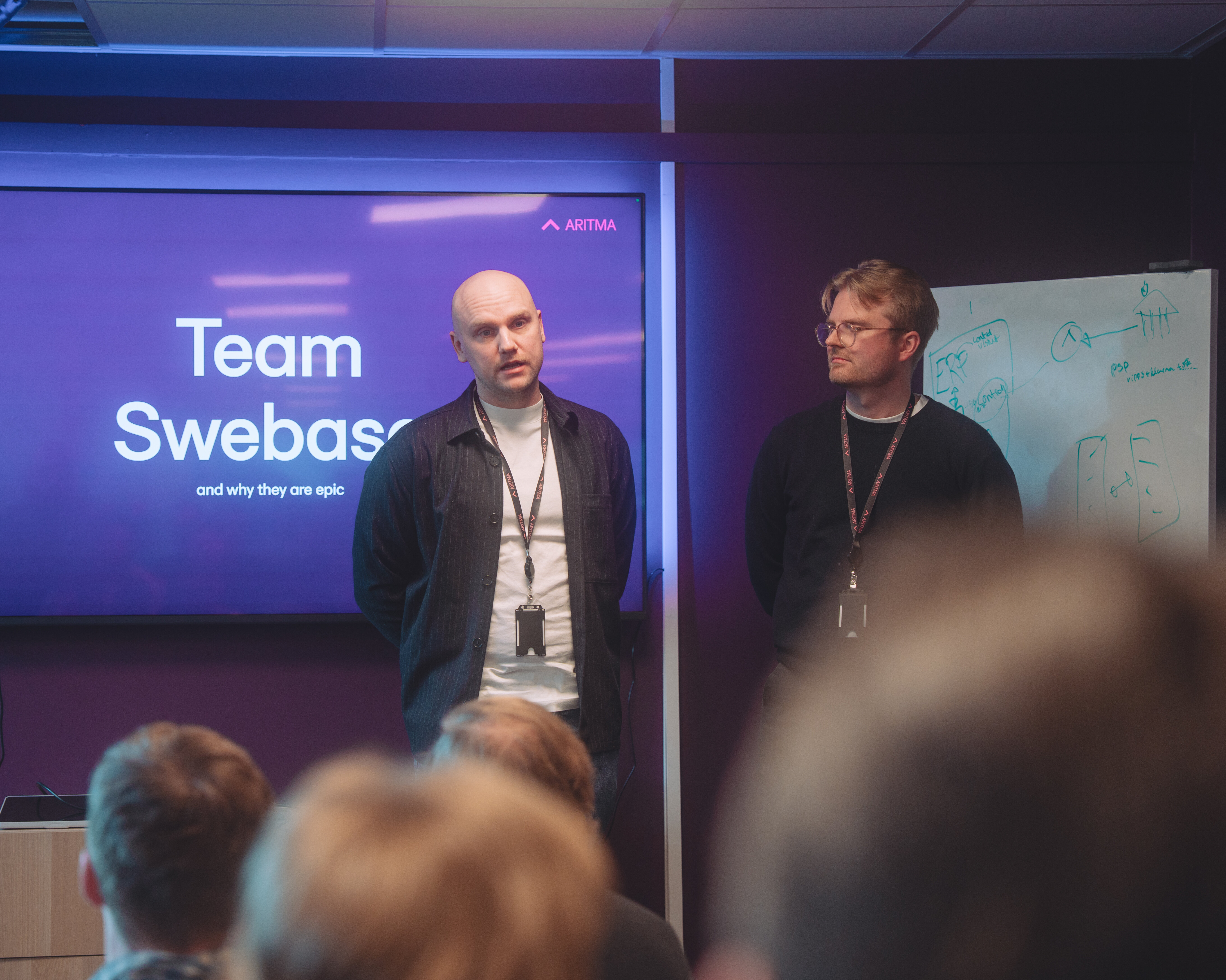 Two members of Team Swebase presenting at an Aritma event.