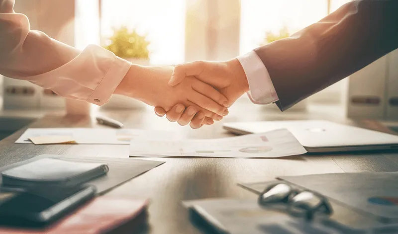 Two people shaking hands.