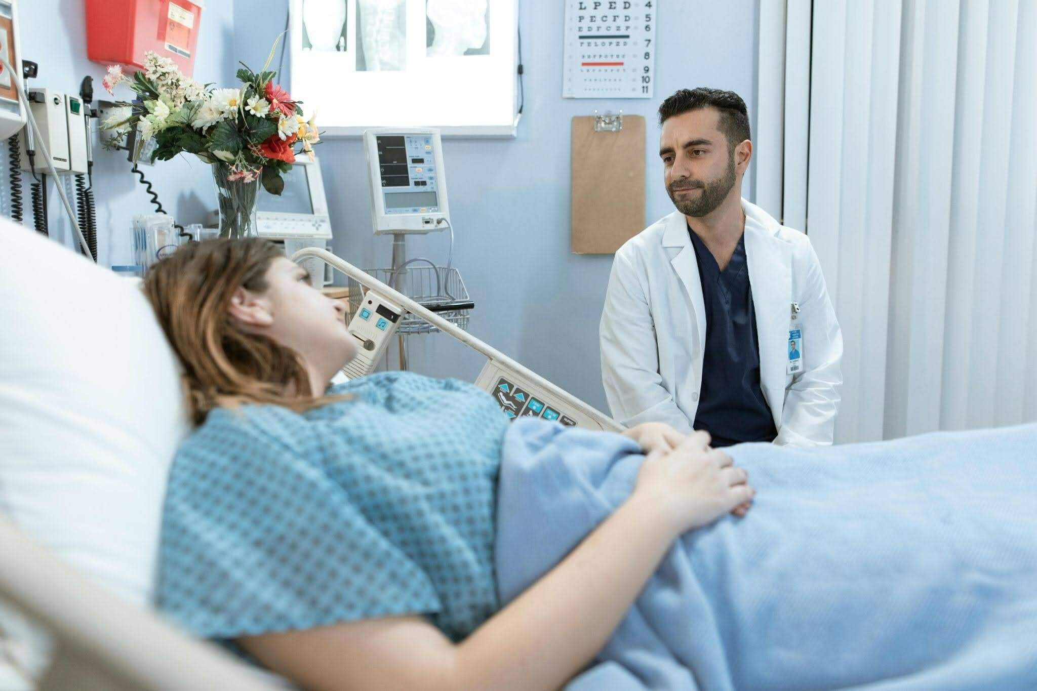 Doctor talking to a Patient in hospital bed