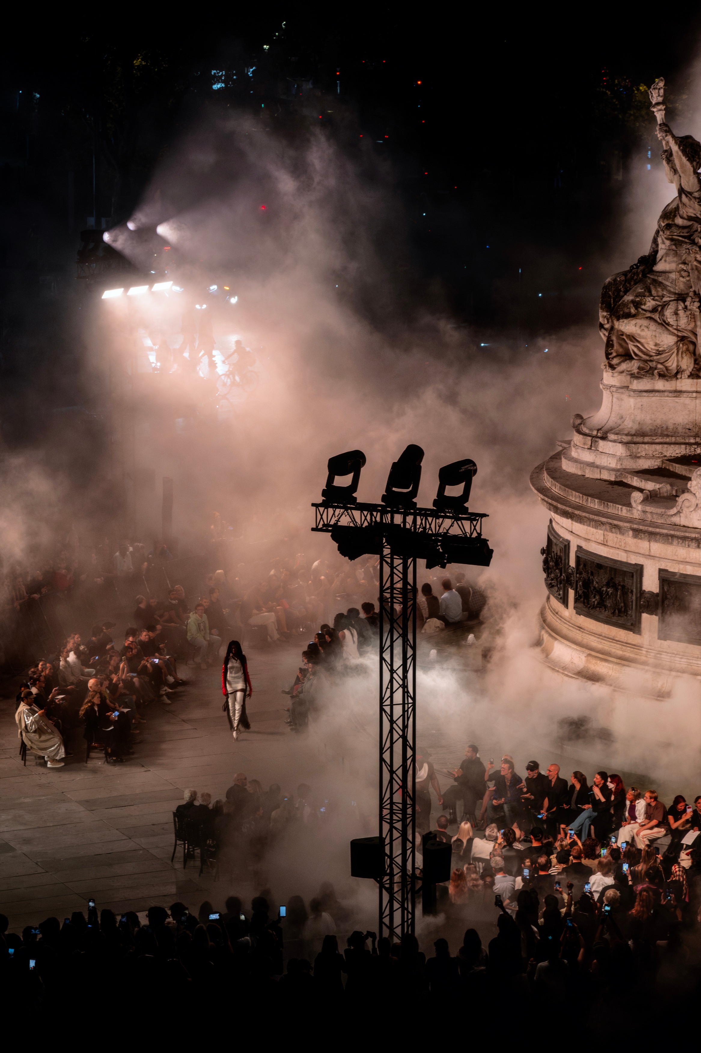 A model walking through the fog at Place de la République — © Ophélie Maurus