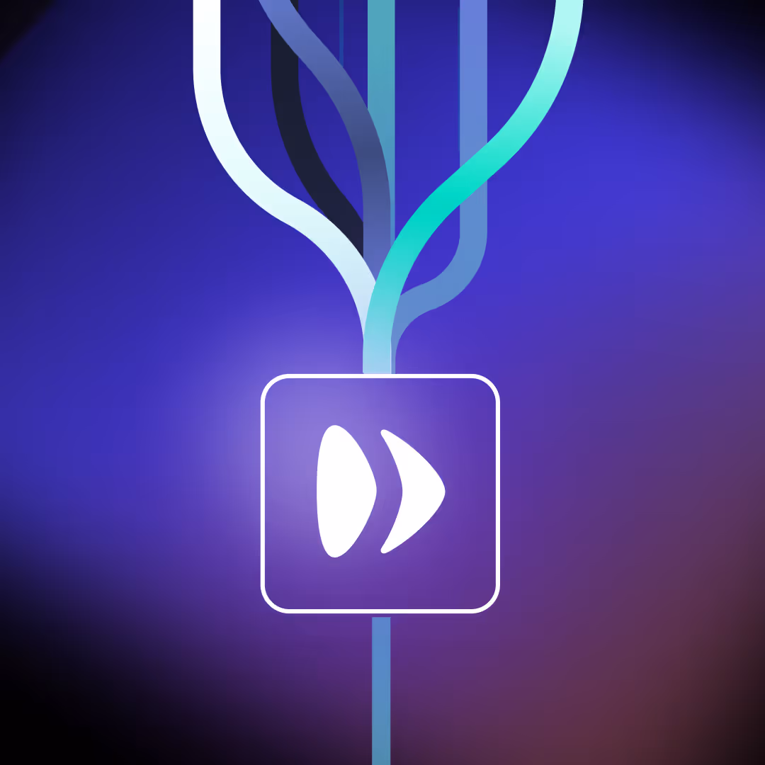 Woman in orange jacket working at a desk with paperwork, laptop, and cardboard boxes in a bright office.