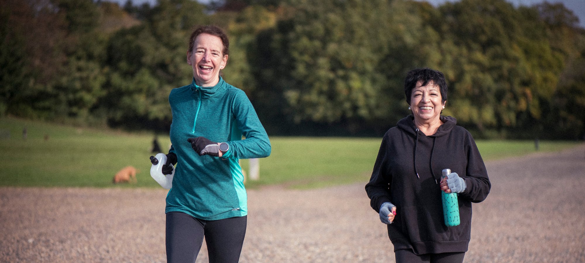 lady lying on grass with flowers over eyes