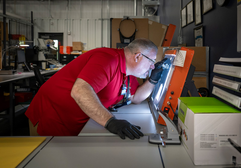 Phoenix Employee studying a neutron image