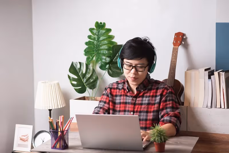 IT engineer applies for a job in front of a laptop at his home