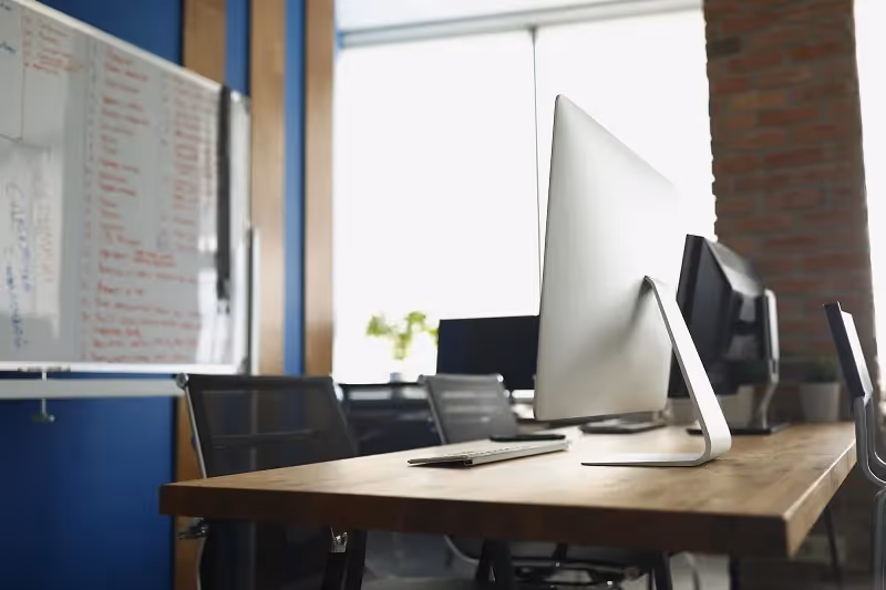whiteboard and computers at the office