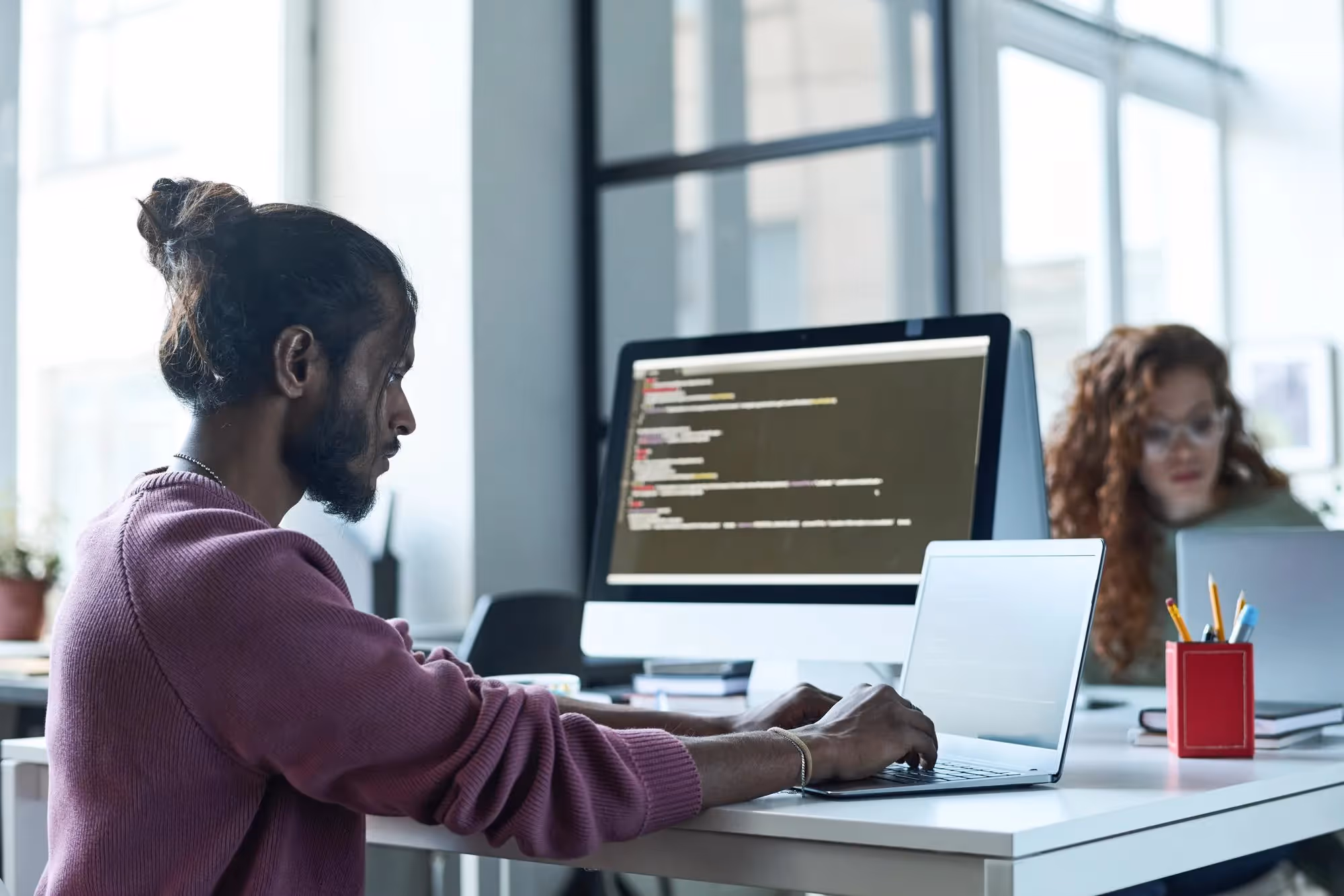 Site reliability engineer working in an office