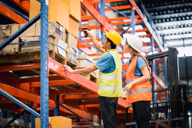 Warehouse workers using barcode scanner