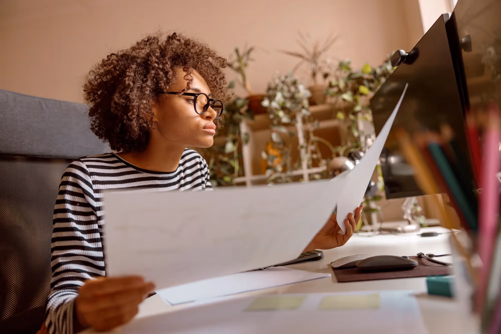 A platform engineer working at the office to enable developer self-service.