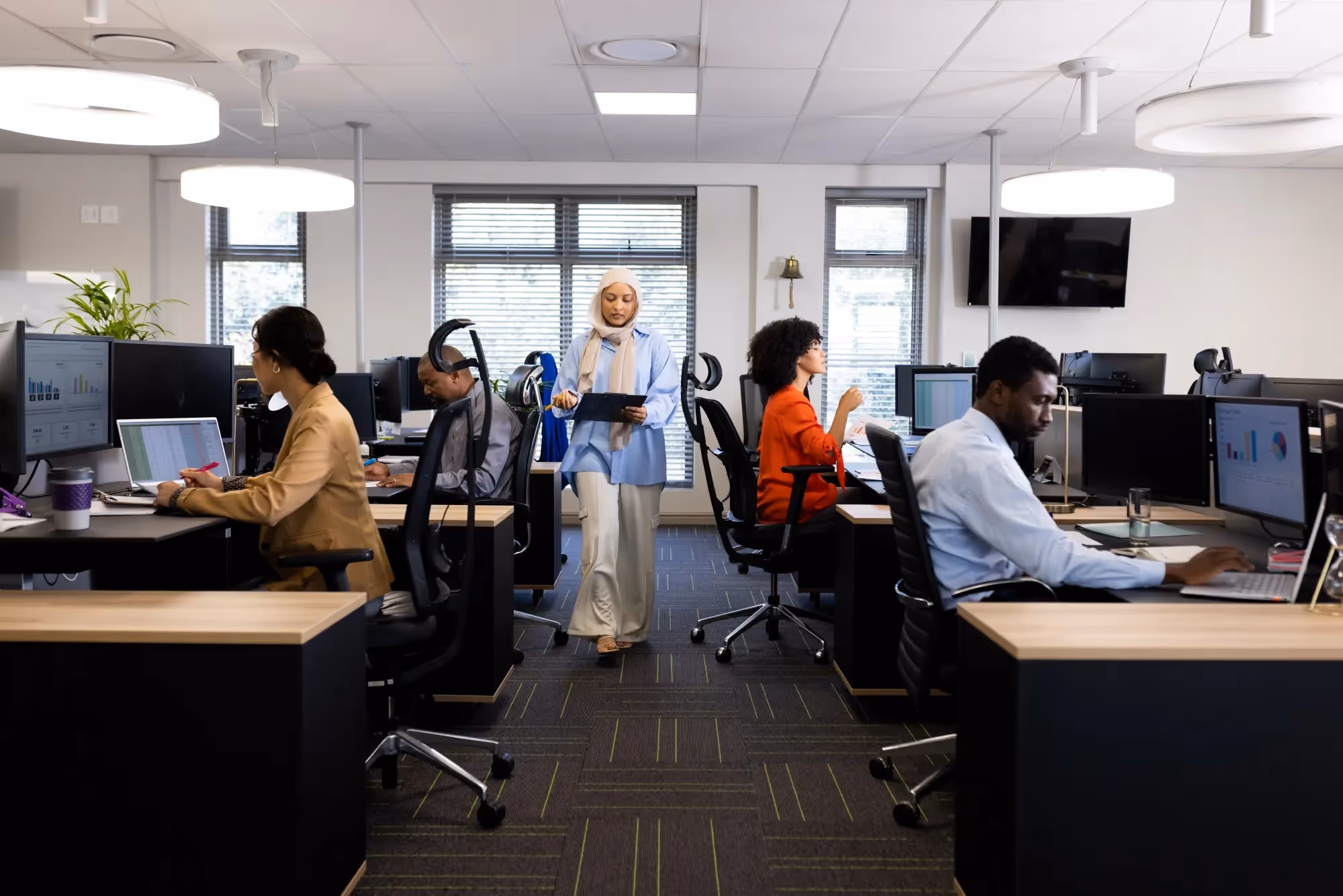 Diverse IT experts working on a project at an offshore development center.