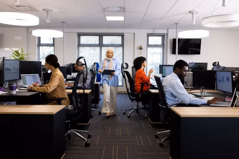 Diverse IT experts working on a project at an offshore development center.