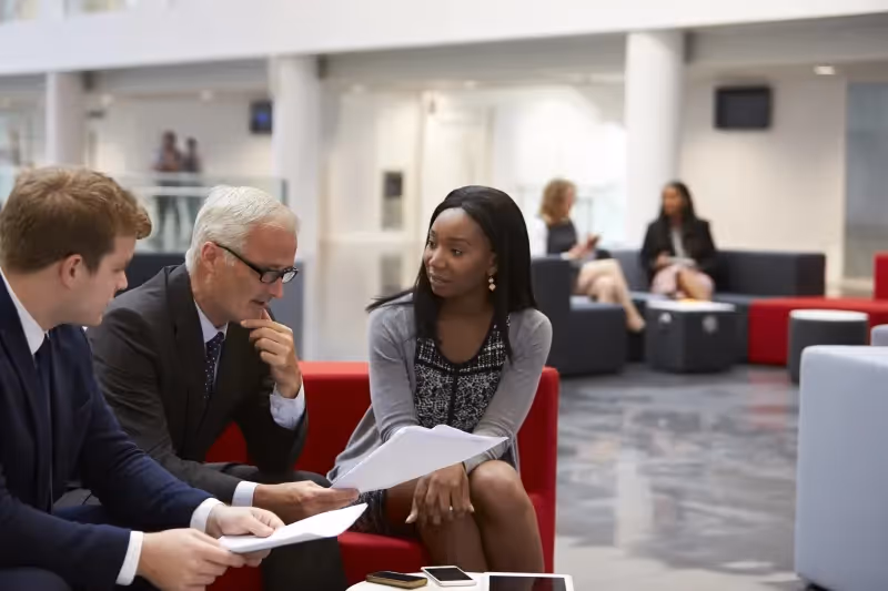 Business people discussing the benefits and drawbacks of onshore and offshore IT outsourcing models