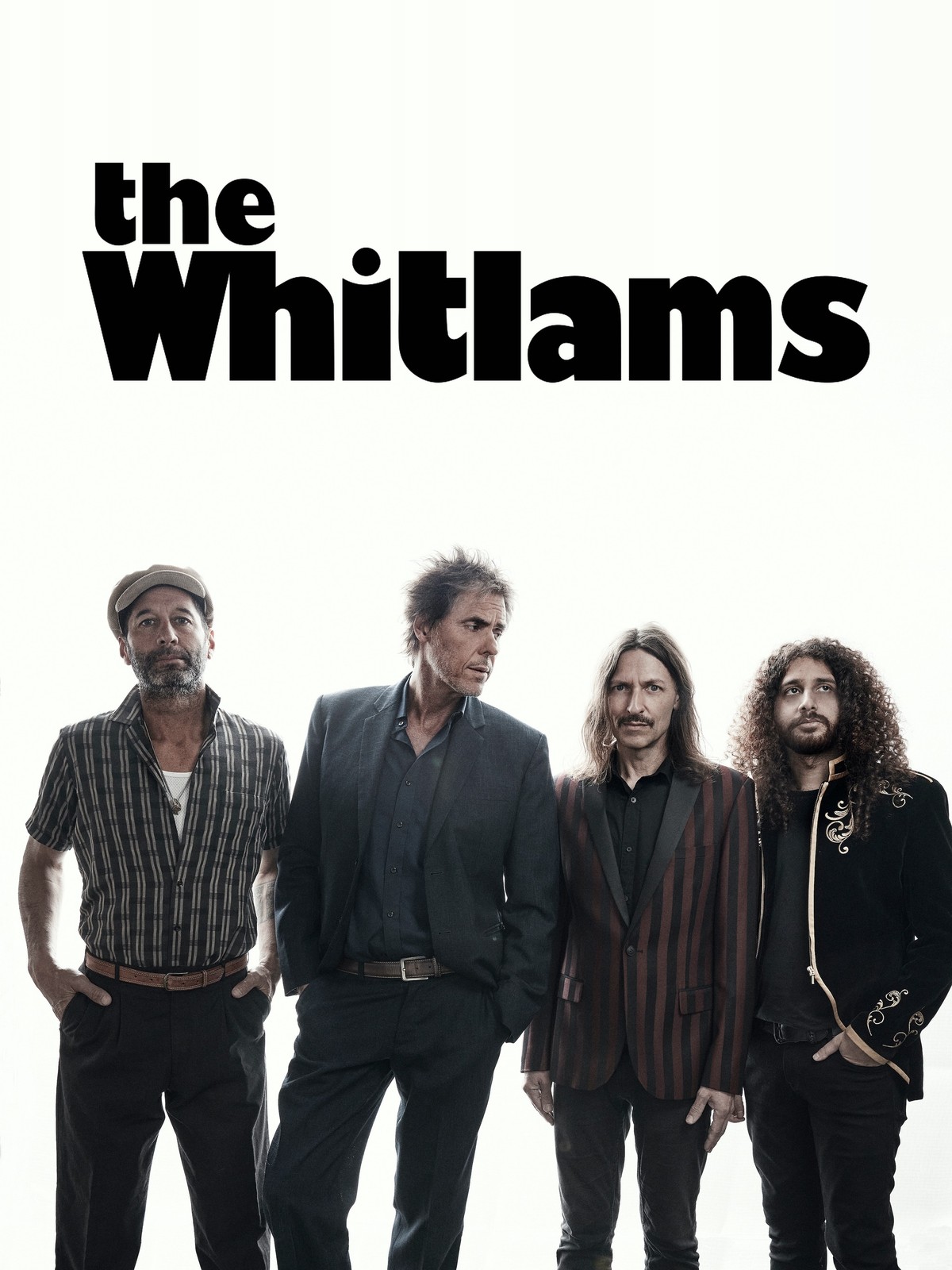 The Whitlams logo above the four band members on a white backdrop