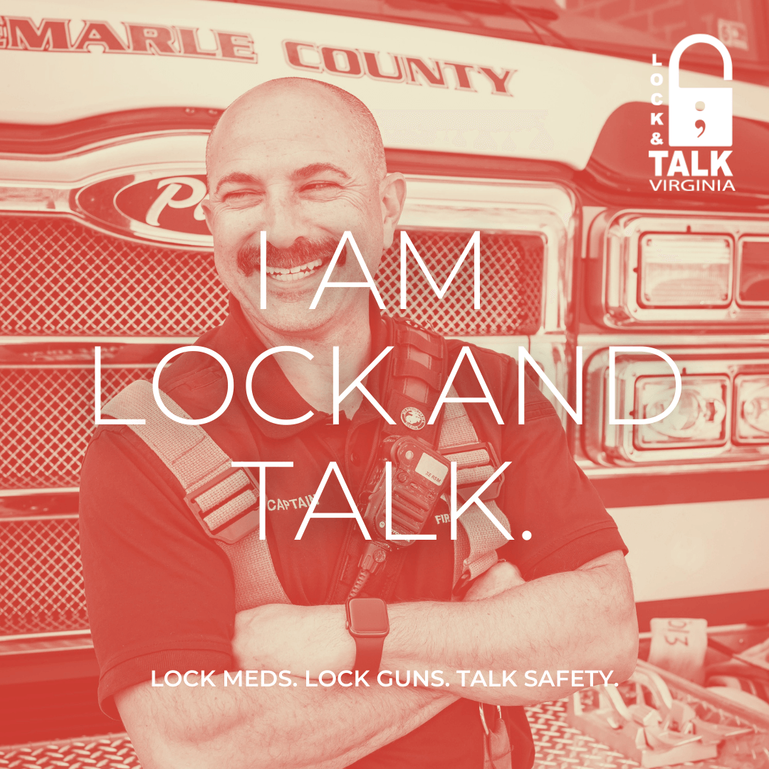 Portrait of smiling firefighter in front of firetruck