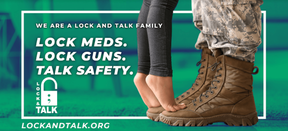 Child standing on military parents’ boots