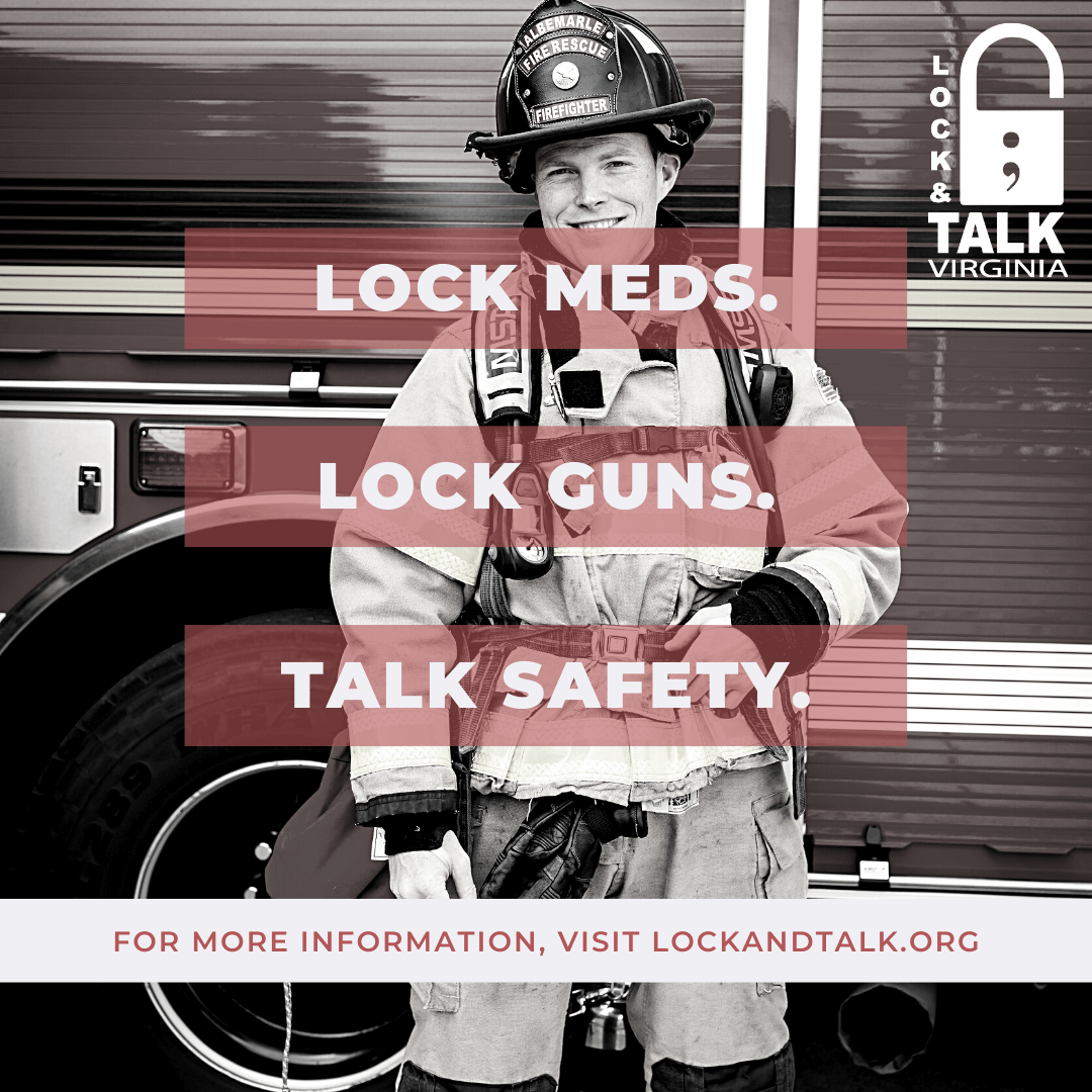 Smiling firefighter in front of the side of a fire truck