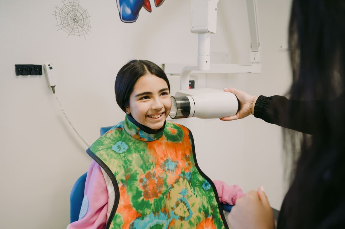 Teenage patient receiving dental examination at Just For Kids Dental in Waxahachie, TX