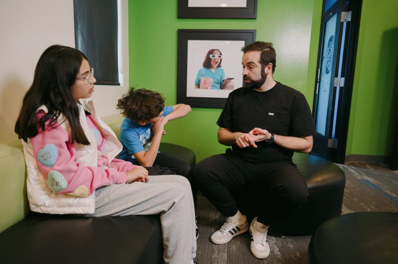 Child receiving gentle dental treatment with modern numbing techniques at pediatric dental office