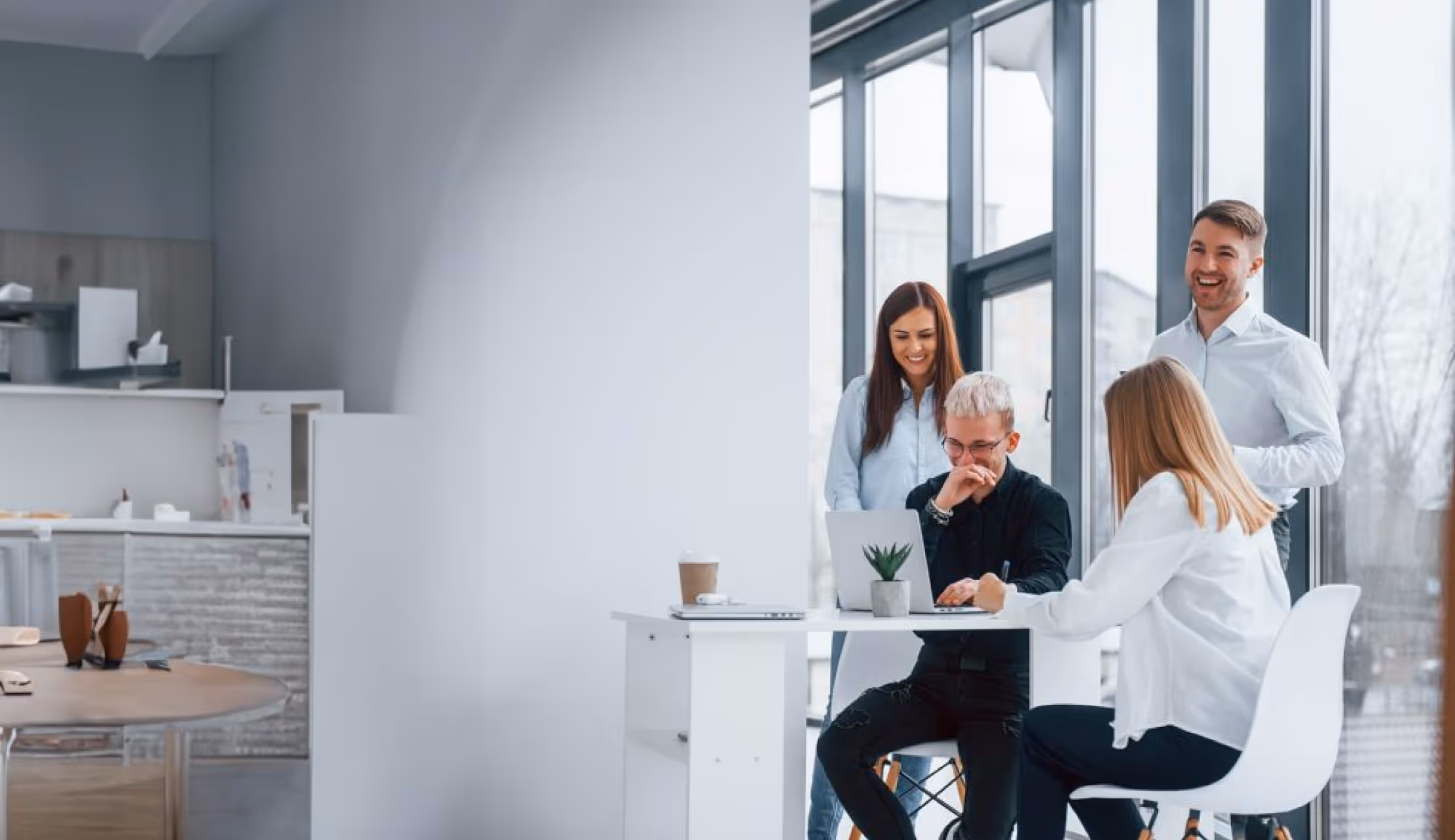 For the final team-oriented lifestyle image (image_a2f57a.jpg), the alt text should emphasize the collaborative advisory and modern efficiency benefits of using high-end "accounting software for family office."  Recommended Alt Text alt="A collaborative team of financial advisors in a modern office using accounting software for family office to analyze wealth performance data on a laptop.