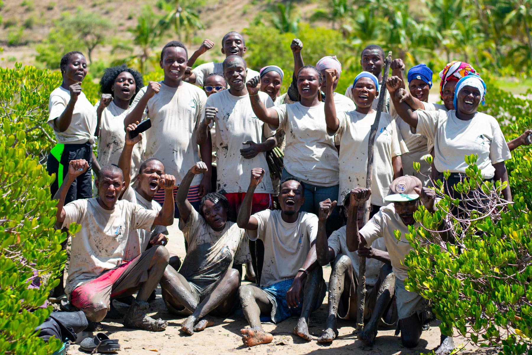 Youth Pawa team and community members after planting mangroves.