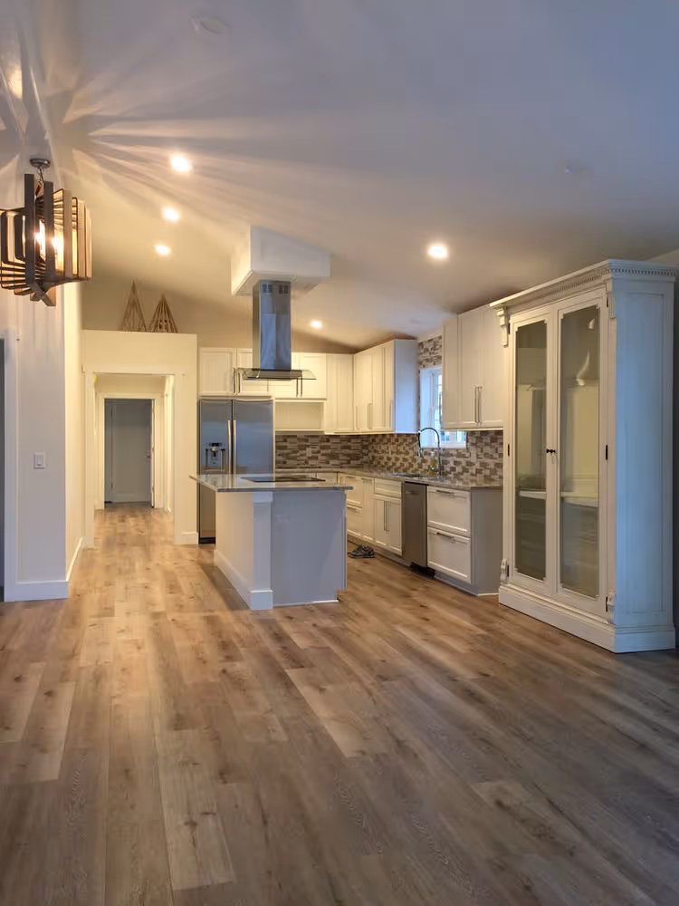 Vinyl plank flooring installation in a modern living room