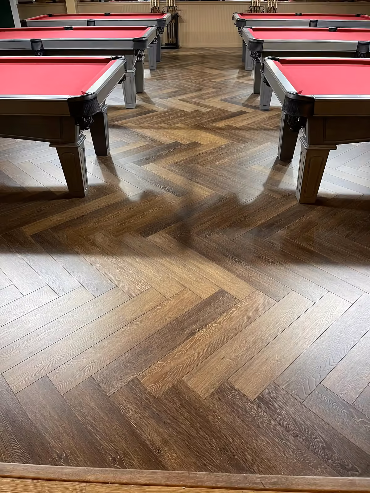 Commercial flooring glue-down herringbone installation – Seattle, WA, 2026