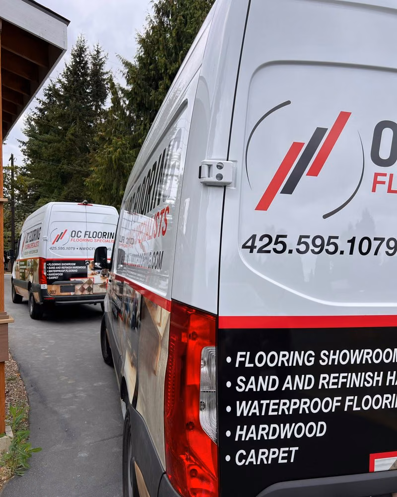 OC Flooring refinishing crew sanding a hardwood floor in a Snohomish County home