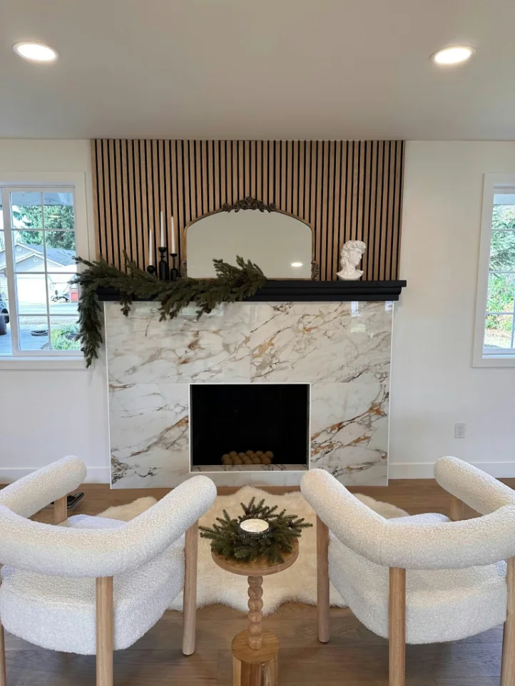 Living room fireplace surround clad in marble-look porcelain slab