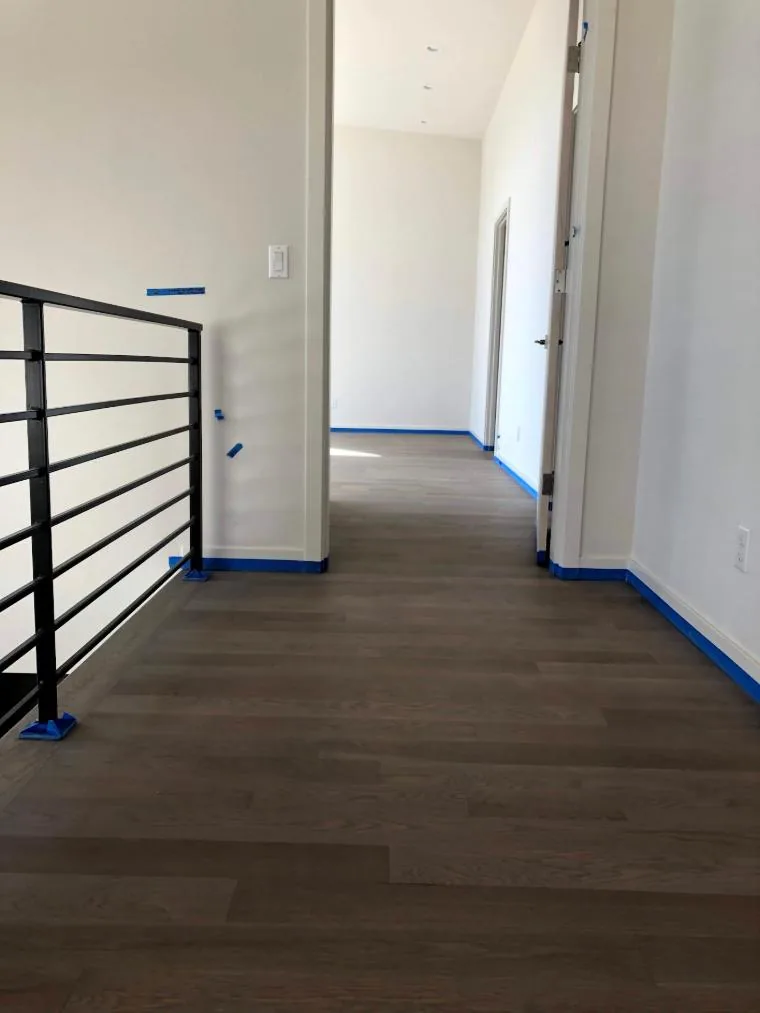 Greige weathered white oak floor in a hallway