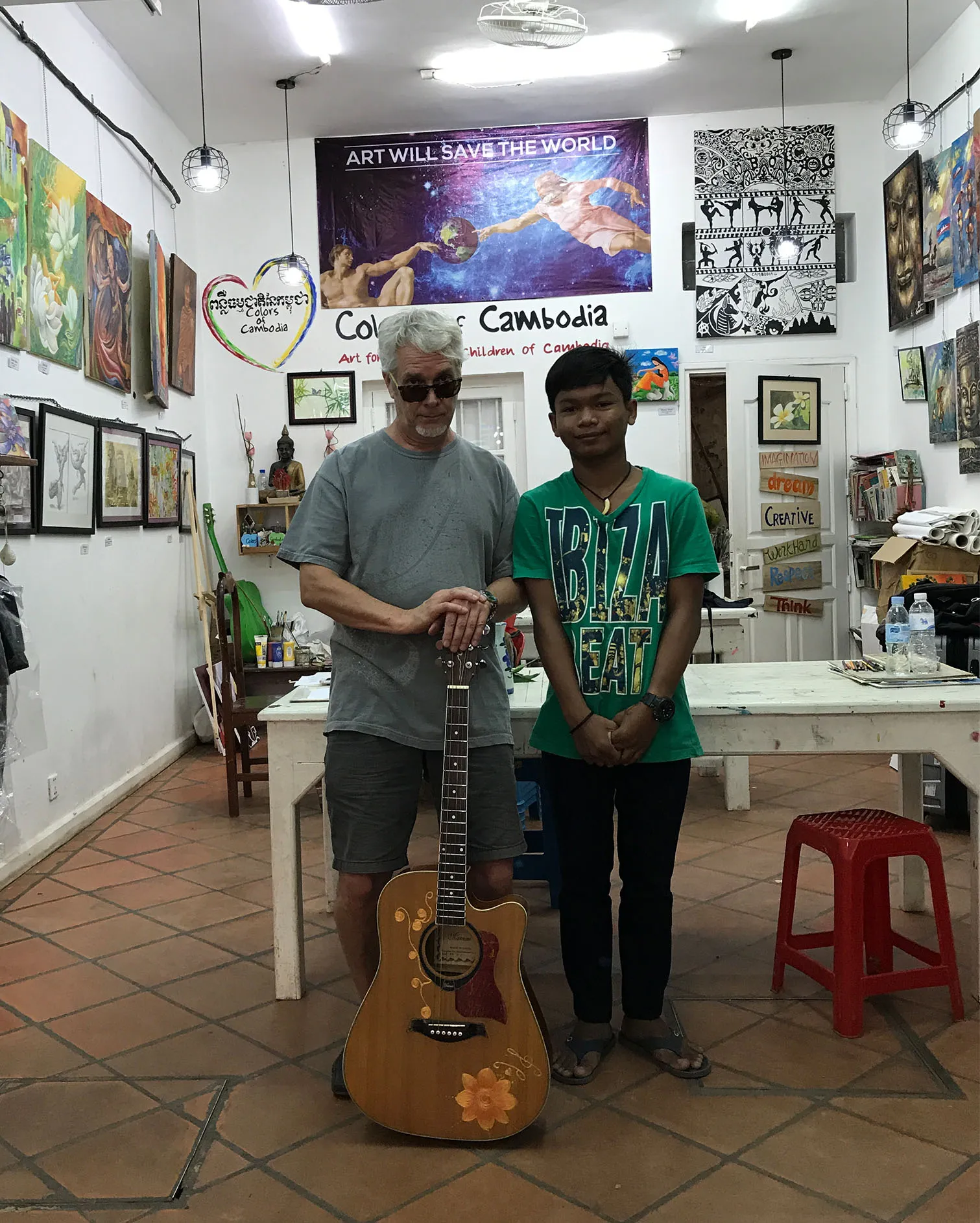 Bill Gentry and student at Colors of Cambodia Charity art school.