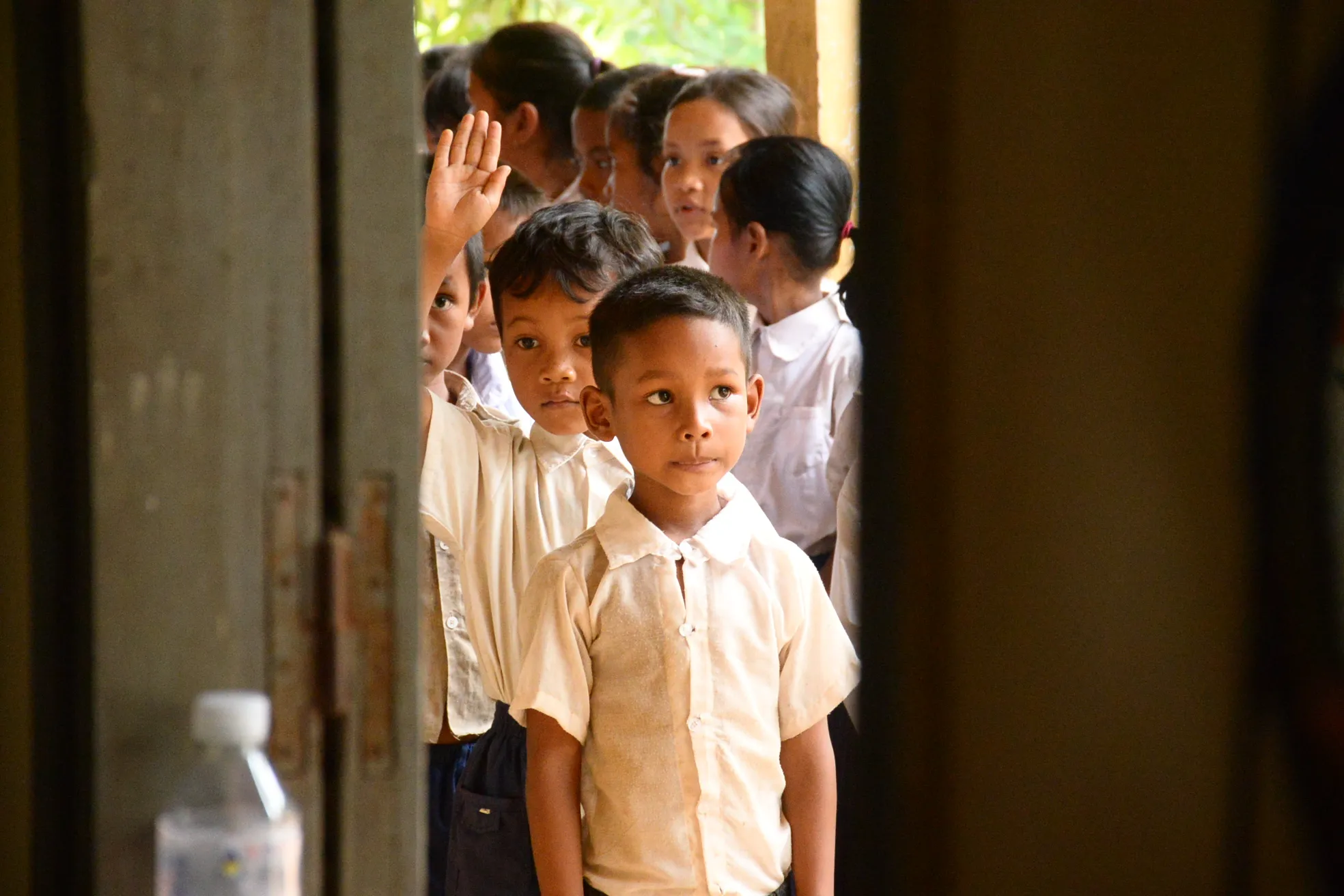 Kids waiting in line outside of art class in Cambodia.