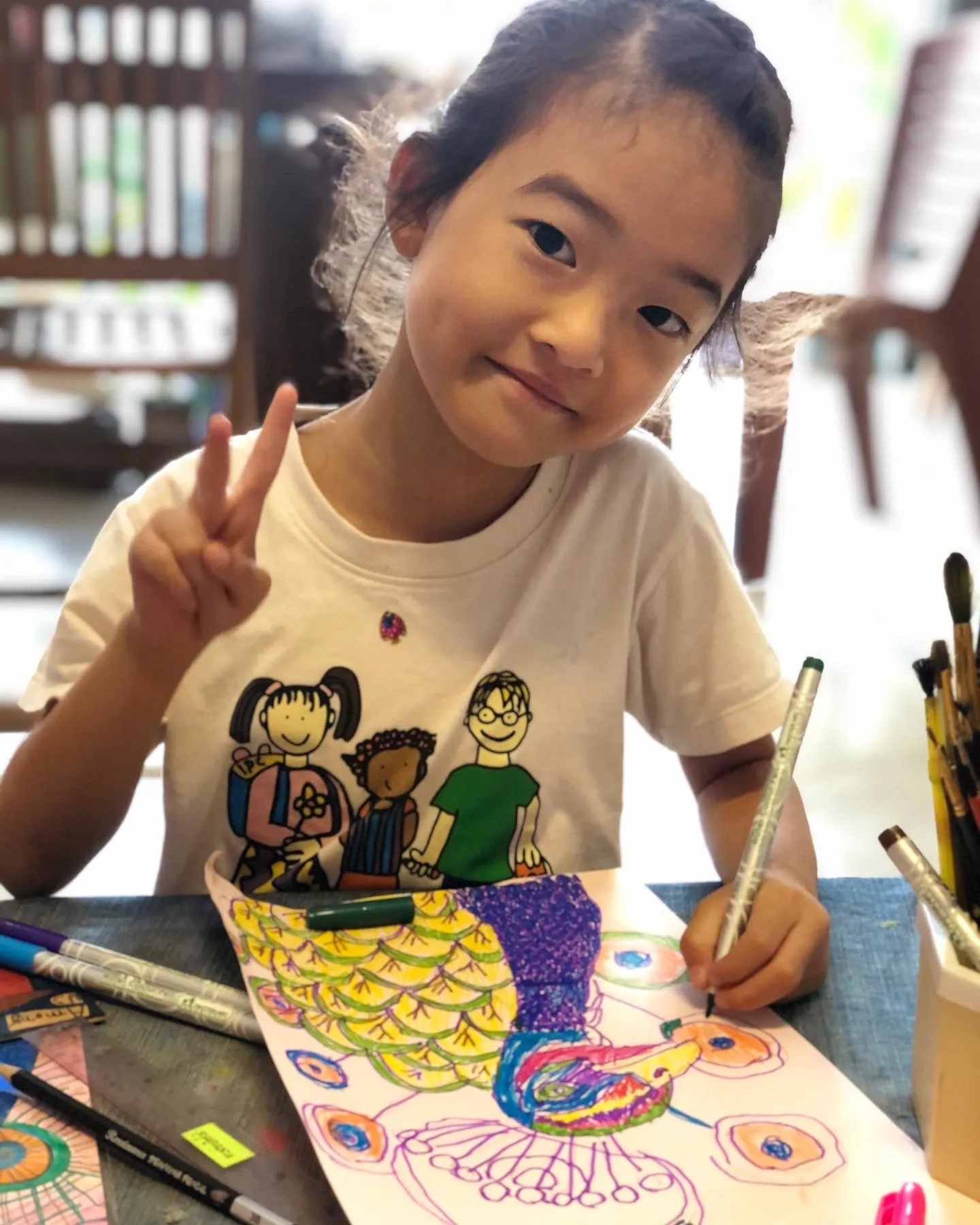 Child painting at Art Will Save the World school.
