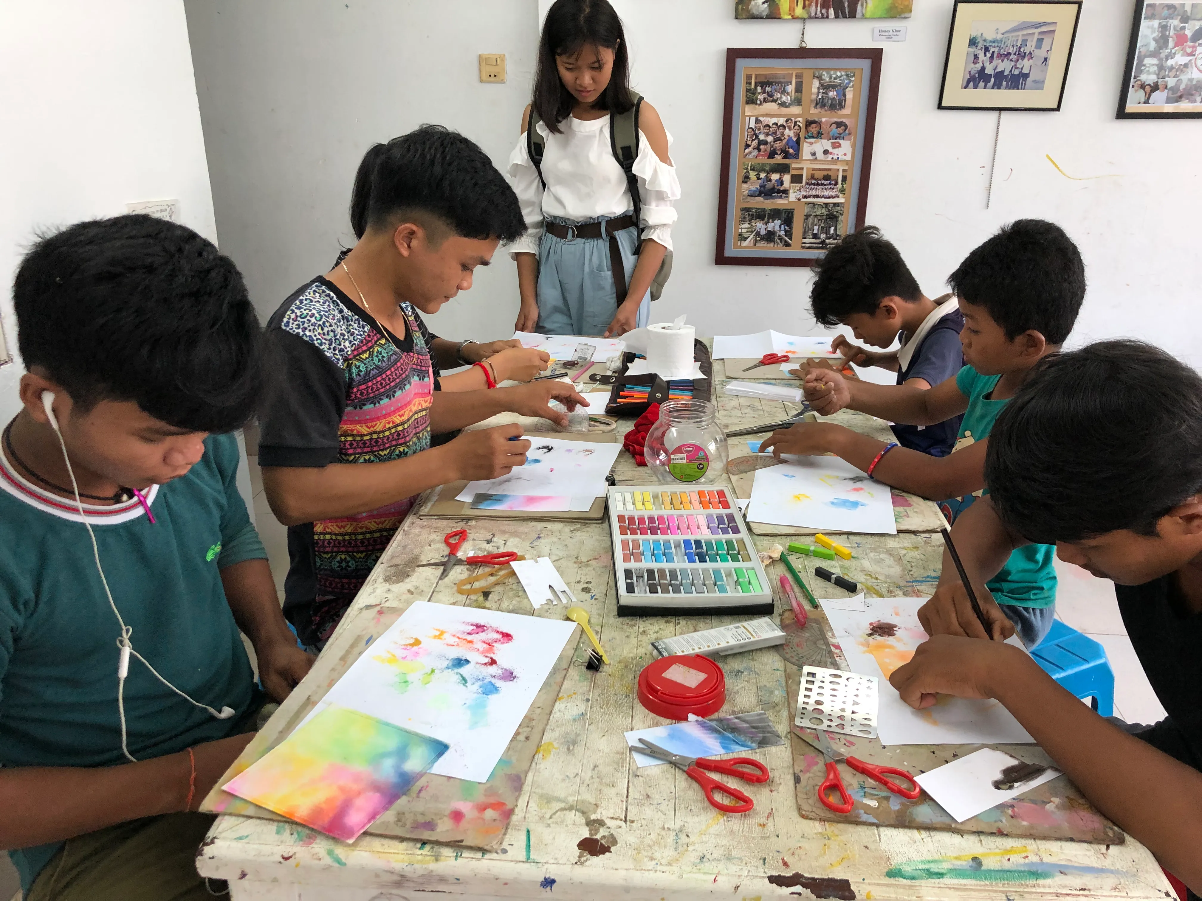 Kids painting at Colors of Cambodia.