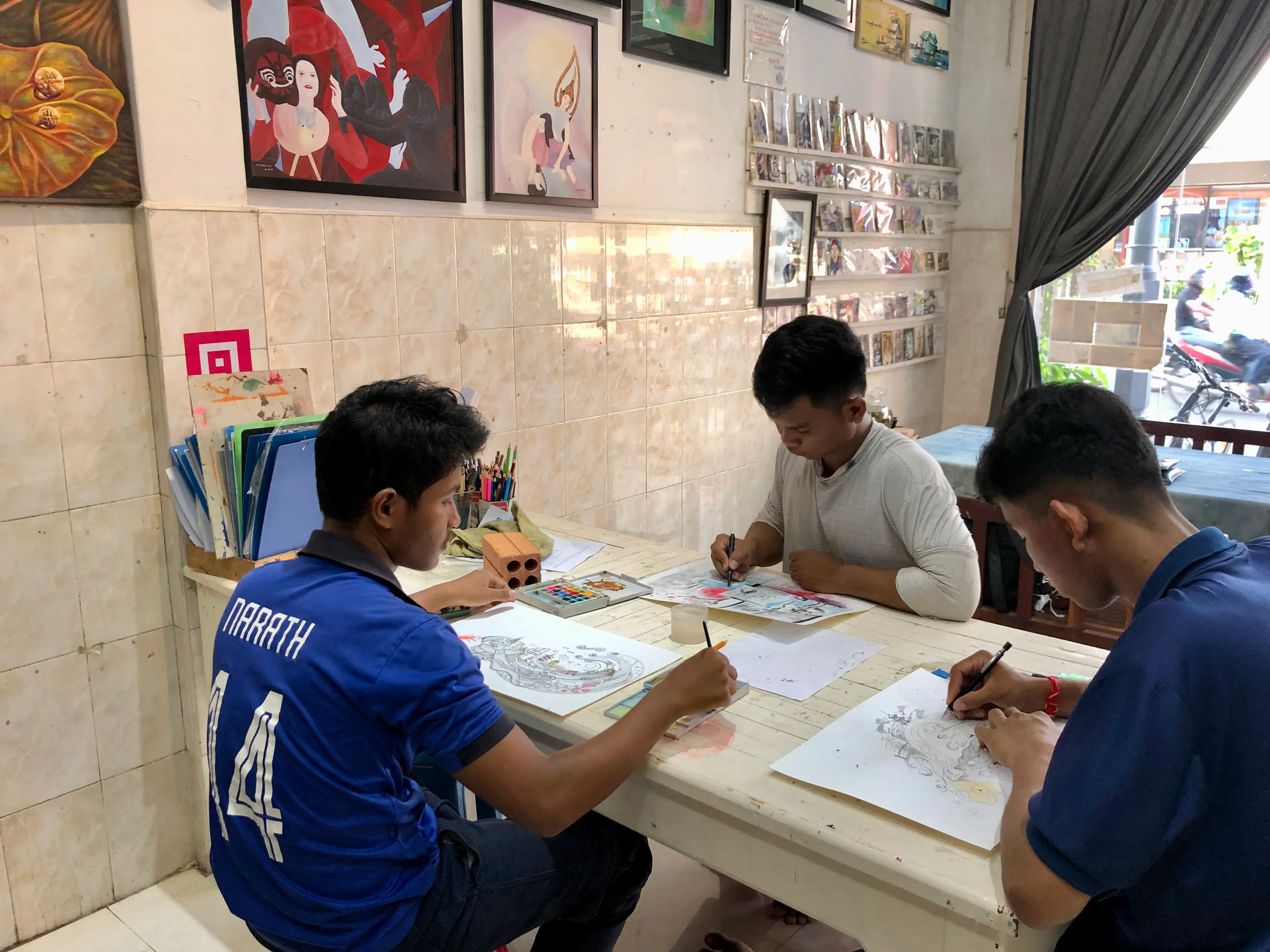 Kids painting at Colors of Cambodia.