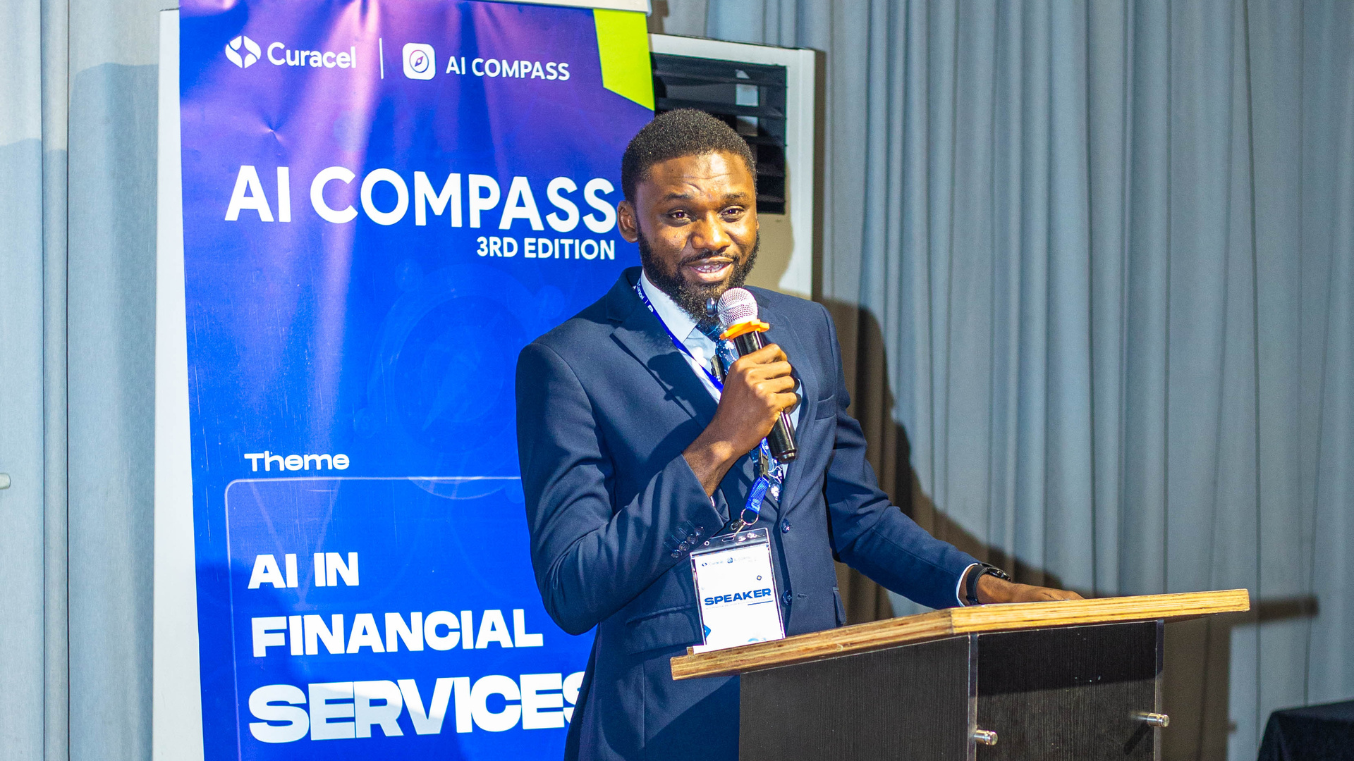 Barr. Abdullahi Abubakar Aliyu delivering the NITDA keynote at AI Compass Lagos 2026.