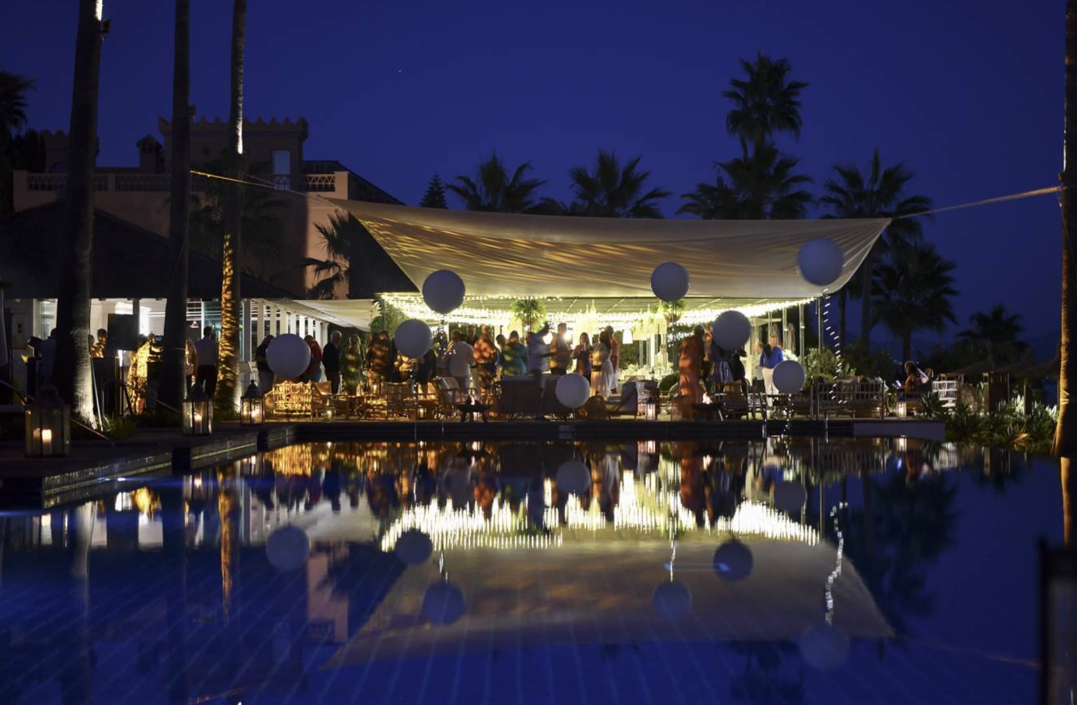 Evening party at a fancy poolside venue at a company offsite in Marbella