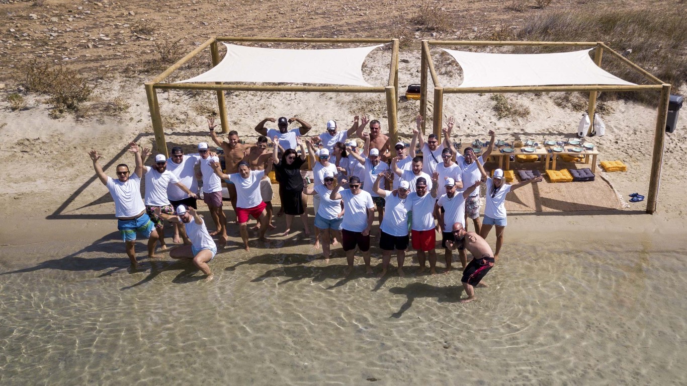 Company offsite team on the beach in Greece