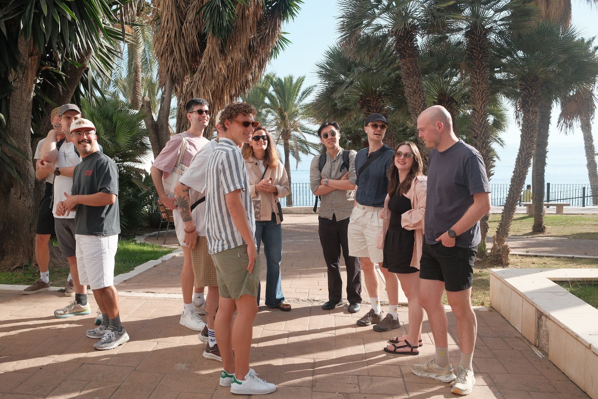 Team heading to a group activity during a company retreat, walking together outdoors