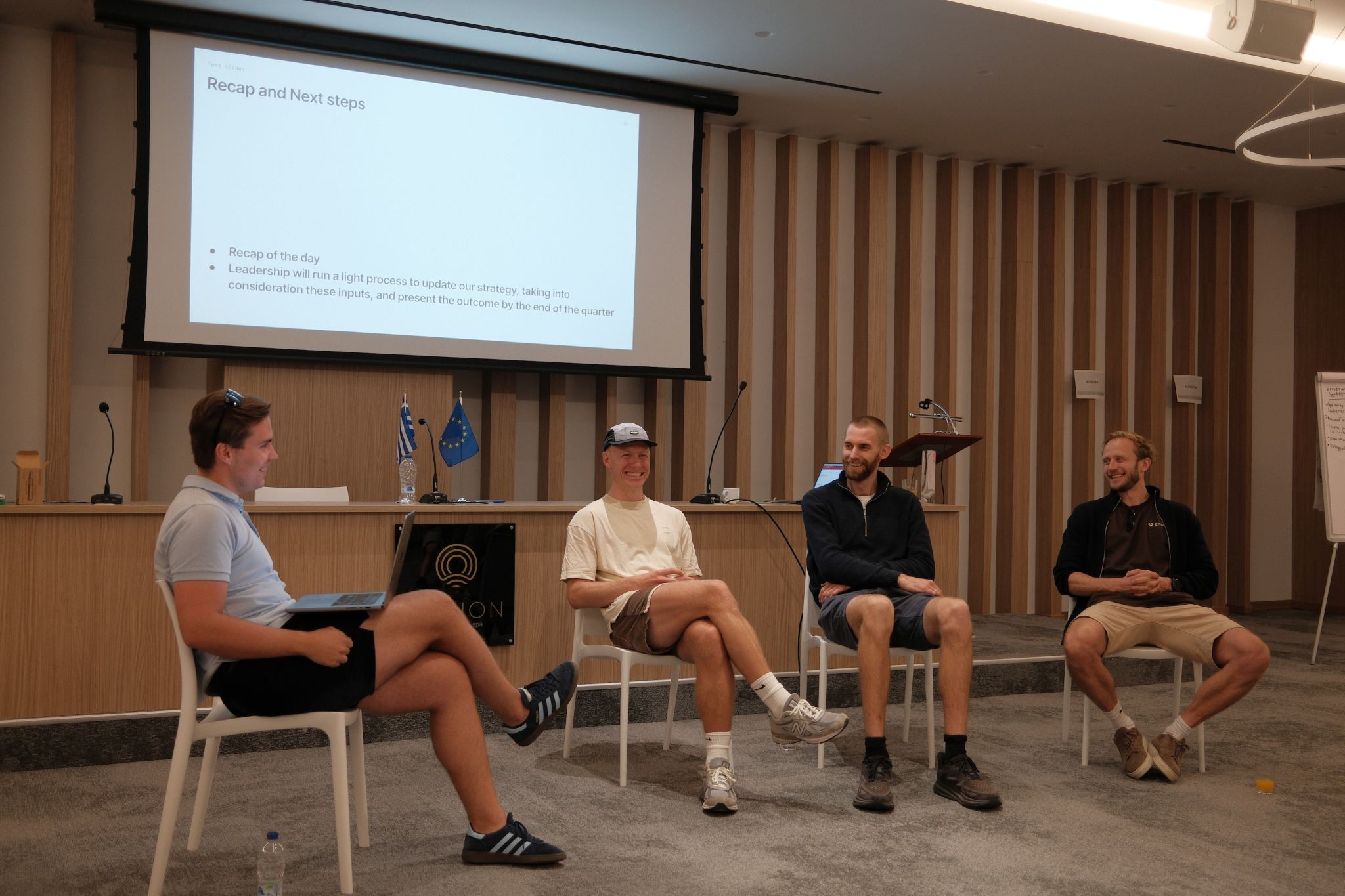 Team workshop session during a corporate offsite with colleagues collaborating in person