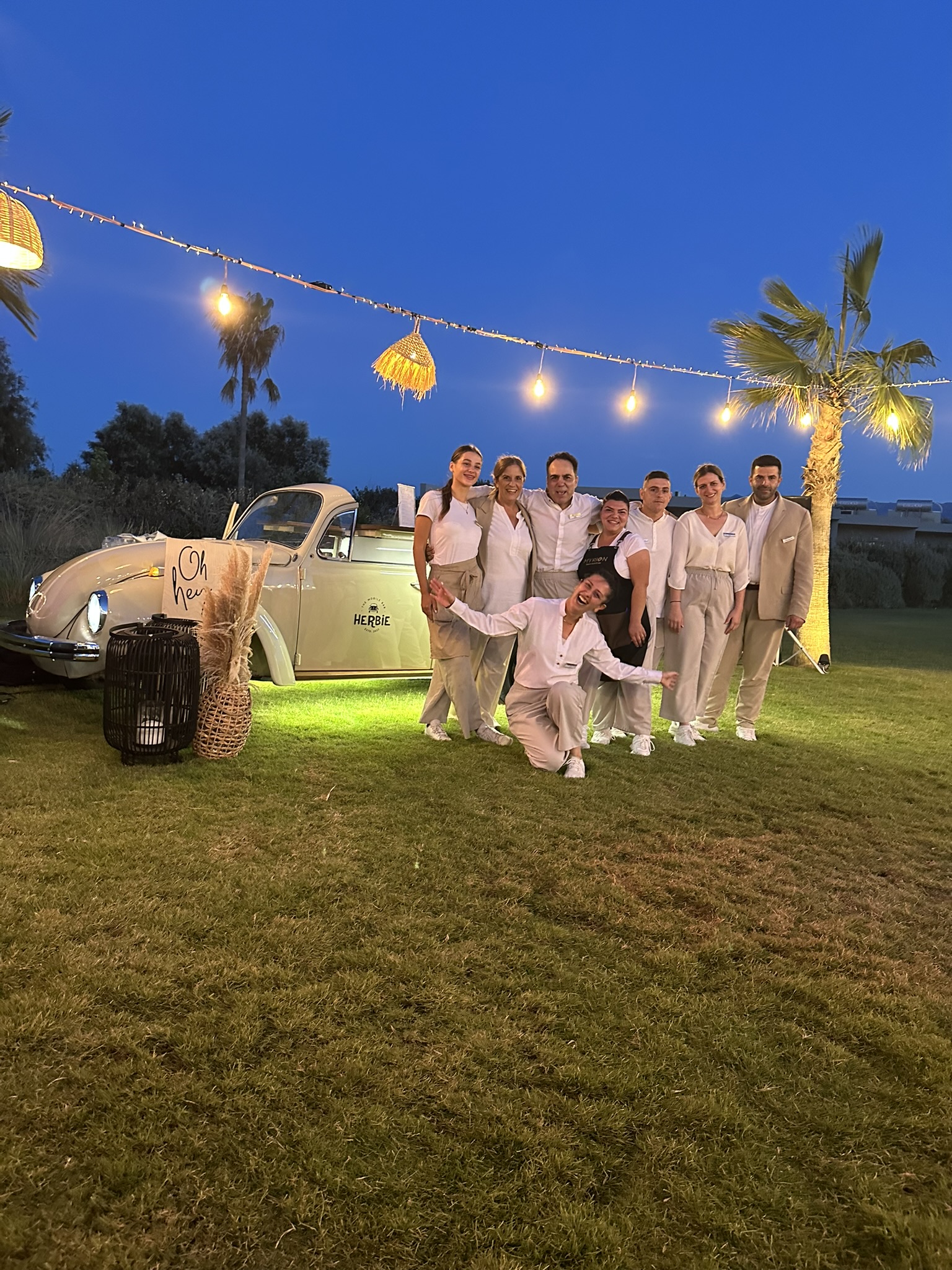 Garden BBQ party and drinks during an evening corporate retreat celebration